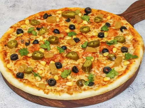 Jain Classic Hawaiian Pizza, no onion no garlic sourdough pizza from Wicked Good Pizza, Gurugram
